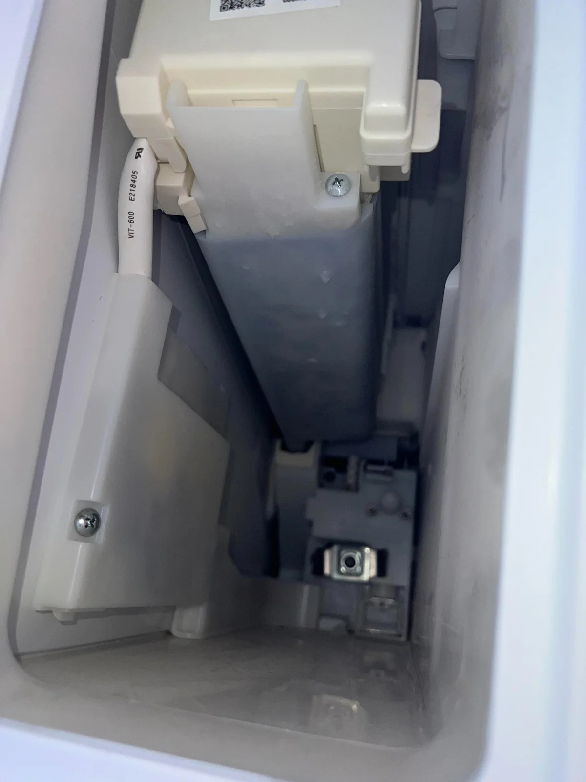 Samsung ice-maker replacement in Southern Hills Ice-maker assembly inside the Samsung refrigerator repaired by Service Brothers in Southern Hills