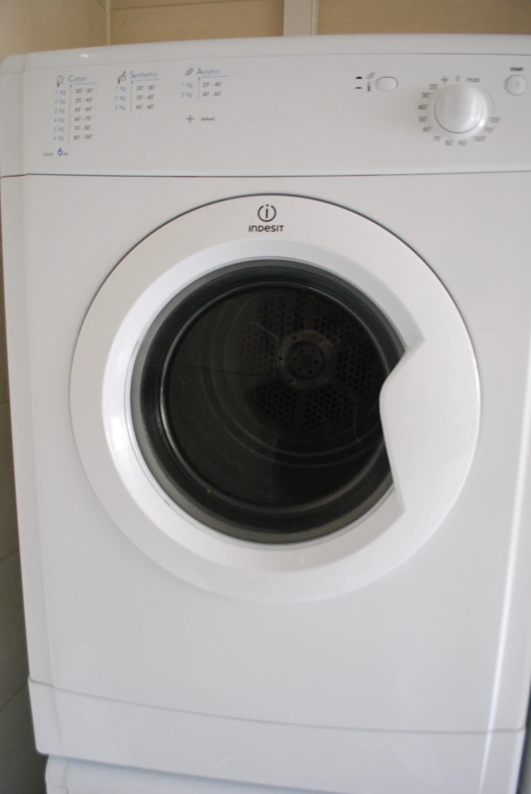 Clothes dryer with the door open and drum visible